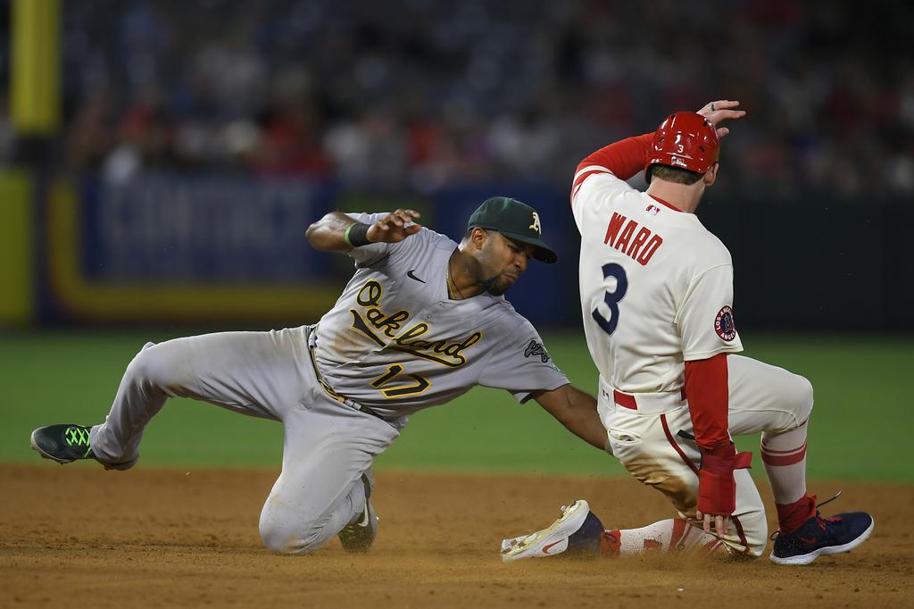 Oakland Athletics shortstop Elvis Andrus throws out Los Angeles Angels'  Taylor Ward at first base during the third inning of a baseball game in  Oakland, Calif., Monday, Aug. 8, 2022. (AP Photo/Jeff