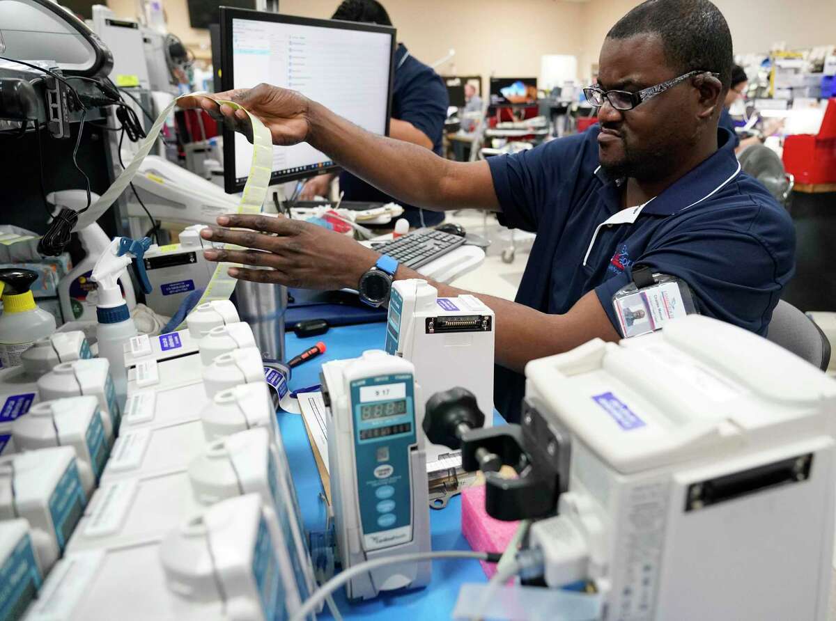 Charles Manuel, a biomedical tech, works on equipment at US Med-Equip, 7028 Gessner Rd., Tuesday, Feb. 18, 2020, in Houston. US Med-Equip is a major supplier of movable medical devices such as respirators, infusion equipment and neo-natal incubators, to hospitals and other health care facilities across the country.