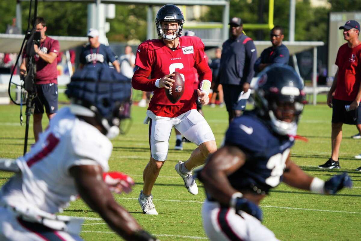 HOUSTON, TX - AUGUST 03: Houston Texans quarterback Davis Mills (10)  prepares to handoff during the Houston Texans Training Camp session at  Houston Methodist Training Center adjacent to NRG Stadium on August