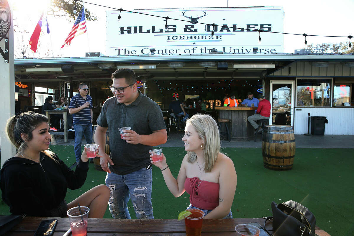 Chloe Bonilla (from left), Matt Palacios and Laura Floyd enjoy drinks in the patio at Hills and Dales Ice House on Friday, Mar. 5, 2021. The ice house recorded $2.5 million in sales in the first six months of 2022. 