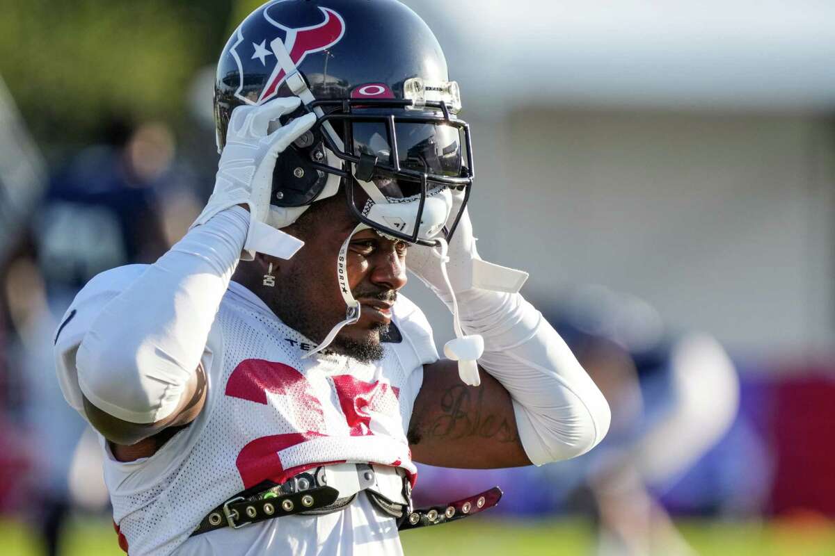 Houston Texans defensive back Desmond King II (25) puts on his helmet during an NFL training camp Wednesday, Aug. 3, 2022, in Houston.