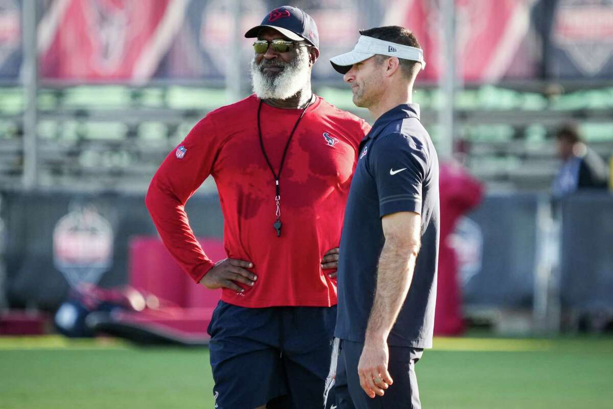 Regardless of what bookmakers say, Texans coach Lovie Smith, left, and general manager Nick Caserio are convinced they have a better team than the one that went 4-13 a season ago.