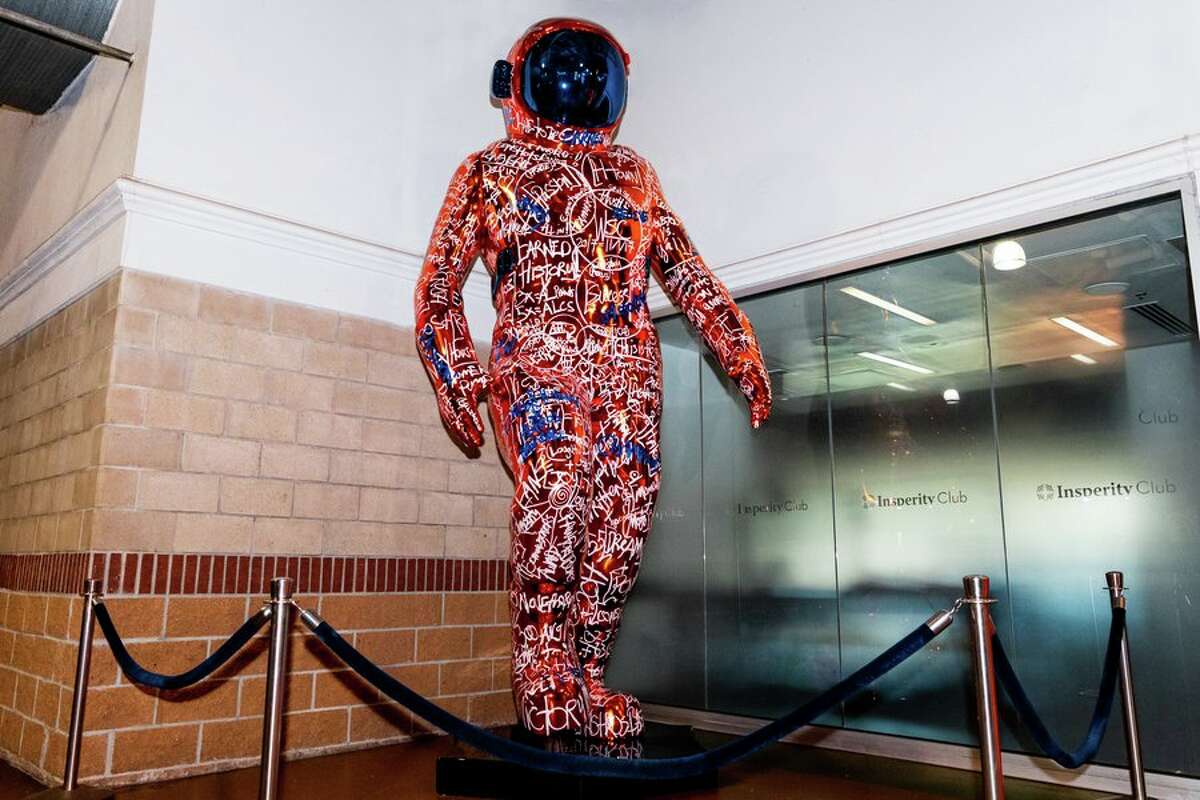 Artist Brendan Murphey covered the spaceman sculpture in player names, awards and slogans to represent the past 15 years of baseball in Houston. 