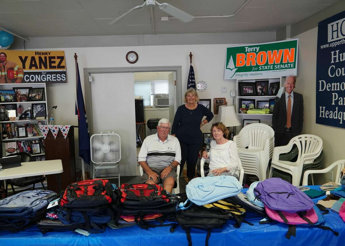 From left to right, Charlie Henry, Wanda Eichler and Marry Ann Kelly at the Huron County Michigan Democratic Party Headquarters in Bad Axe giving ready to give out backpacks.