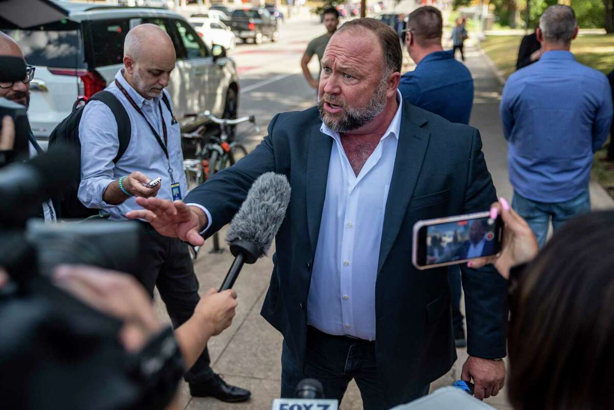 Alex Jones speaks to the media outside the 459th Civil District Court on Aug. 2 in Austin, Texas.