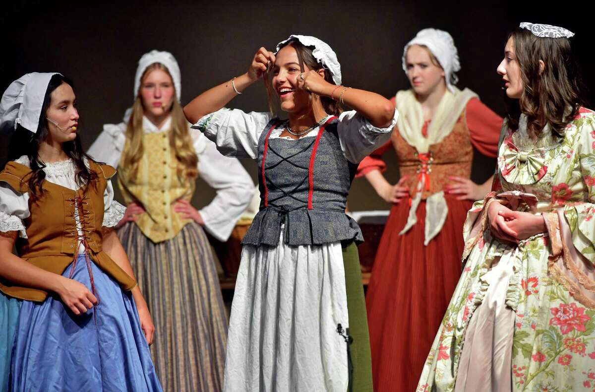 Aliana Aspesi, center, who plays Phoebe Arnold, fixes her hair during a dress rehearsal of the musical "Burning of Norwalk, 1779" at Crystal Theater in Norwalk, Conn., on Tuesday August 2, 2022.
