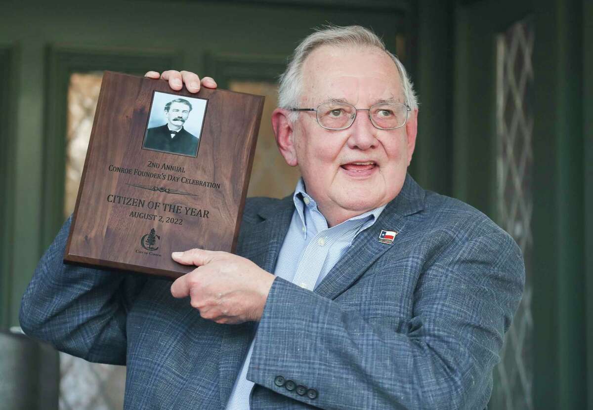 Larry Foerster hold up his award after being named Citizen of the Year during a Founder’s Day celebration to honor city founder Isaac Conroe, Tuesday, Aug. 2, 2022, in Conroe.