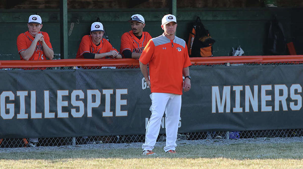 Gillespie coach Jeremy Smith watches his team from in front of the dugout in a game last season at Gillespie. Smith is the 2022 Telegraph Small-Schools Baseball Coach of the Year.