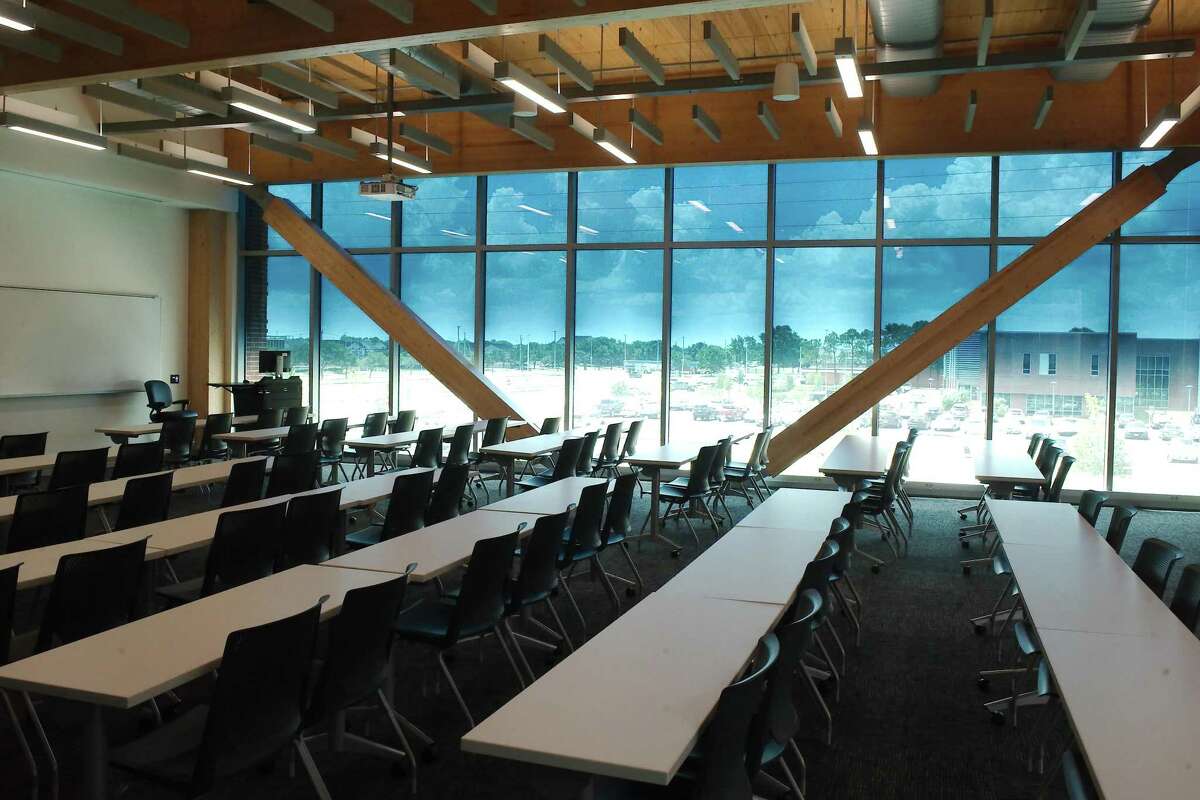 A classroom inside the Anderson-Ball Classroom Building at San Jacinto College Central features graduated electrochromic glass windows that automatically adjust the light according to the brightness of the sun. The building, which opens to students this fall, is built from mass timber, a type of engineered wood touted as being more environmentally friendly than other construction materials.