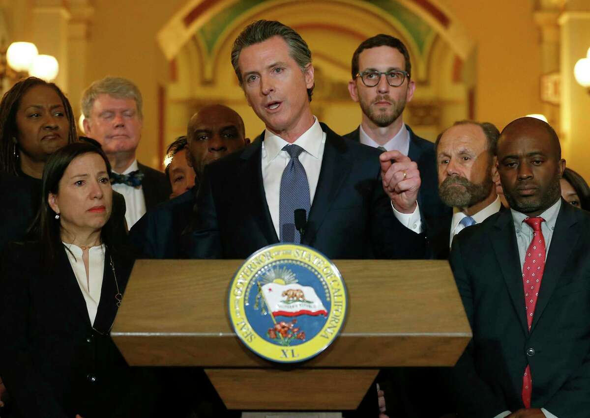 California Gov. Gavin Newsom, shown discussing his decision to place a moratorium on the death penalty in March 2019, has yet to commute any death sentences.