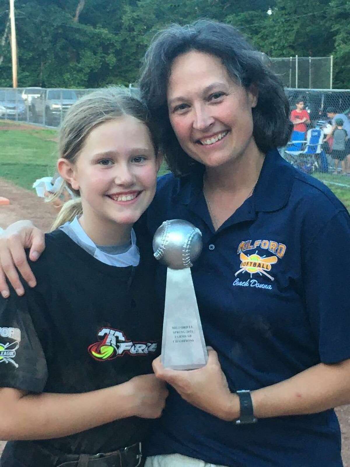 Donna Fagan, right, coached her daughter Riley Fagan-Davis to the 2021 Milford Little League Farms Division title. Fagan-Davis is a part of the Milford team that will play in the Little League Softball World Series Aug. 9-15 in Greenville, N.C.