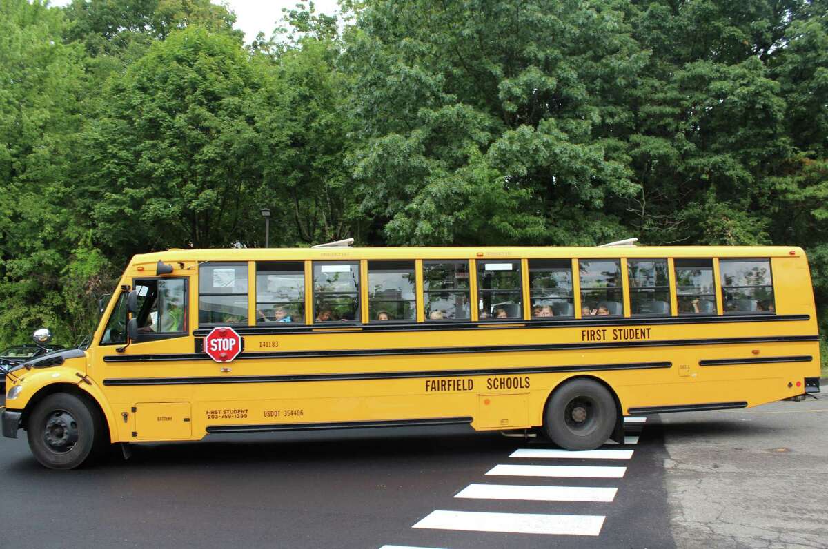 A school bus pulls away after the first day of school on Sept. 1, 2016 at Mill Hill Elementary School in Fairfield, Conn.