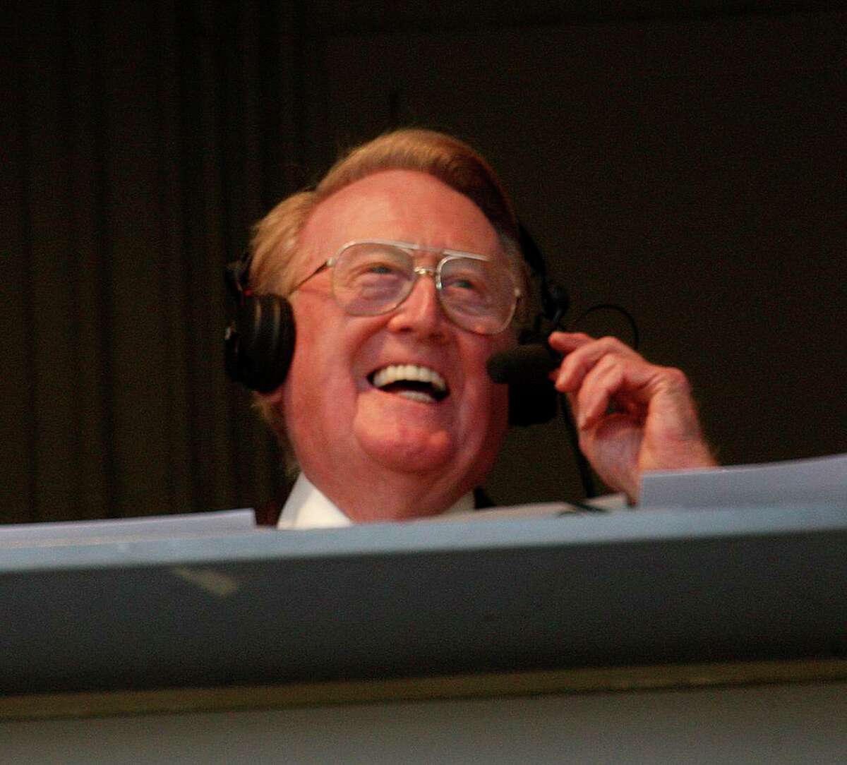 Los Angeles Dodgers sportscaster Vin Scully laughs during the Dodgers-Angels exhibition game at Dodger Stadium on March 28, 2011. (Allen J. Schaben/Los Angeles Times/TNS)