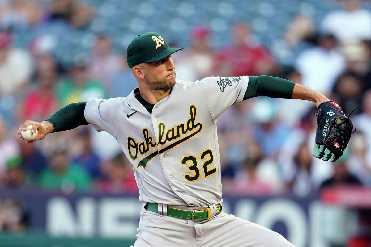 Oakland Athletics starting pitcher James Kaprielian throws to a Los Angeles Angels batter during the first inning of a baseball game Wednesday, Aug. 3, 2022, in Anaheim, Calif. (AP Photo/Marcio Jose Sanchez)