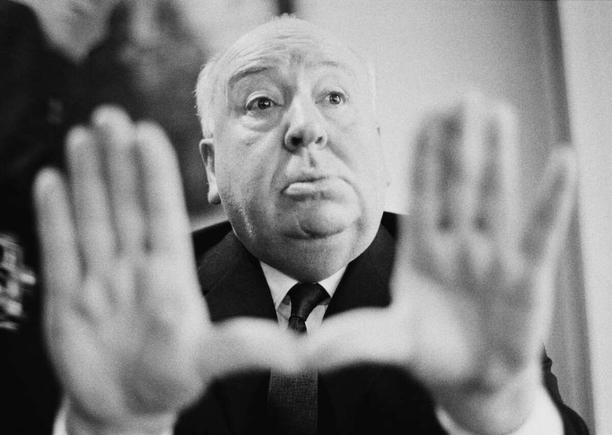 Alfred Hitchcock: The life story you may not know No one comes close to rivaling Sir Alfred Hitchcock in the cinematic world of thrills and suspense. For decades, he kept audiences at the edge of their seats, eyes glued to the screen as innocent men were unjustly accused of crimes, unwitting bystanders were entangled in nets of intrigue, and lovers grew suspicious of one another's intentions. Stacker put together a list of 25 facts about the life of Hitchcock you may not know, drawing from specialized film channels, movie archives, historical accounts, critic reviews, and education resources. From common roots in London, Hitchcock studied engineering and art and learned his way around a movie studio. His debut behind the camera as a director took place before movies had sound. He was a pioneer in cinematic techniques, perfecting the use of shadow and light and steering the camera in pans and close-ups to propel the plot. He invented the  use of what's called the zoom dolly in the film "Vertigo," having the camera zoom into a scene as it simultaneously dollies out. His storytelling was peerless, as he spun sagas of suspicion, paranoia, mistaken identity, and the fateful meeting of strangers in films. The best actors of the times brought his drama to life, and his influence to this day on the cinematic arts is unmeasurable. You may also like: Celebrities you might not know are LGTBQ+