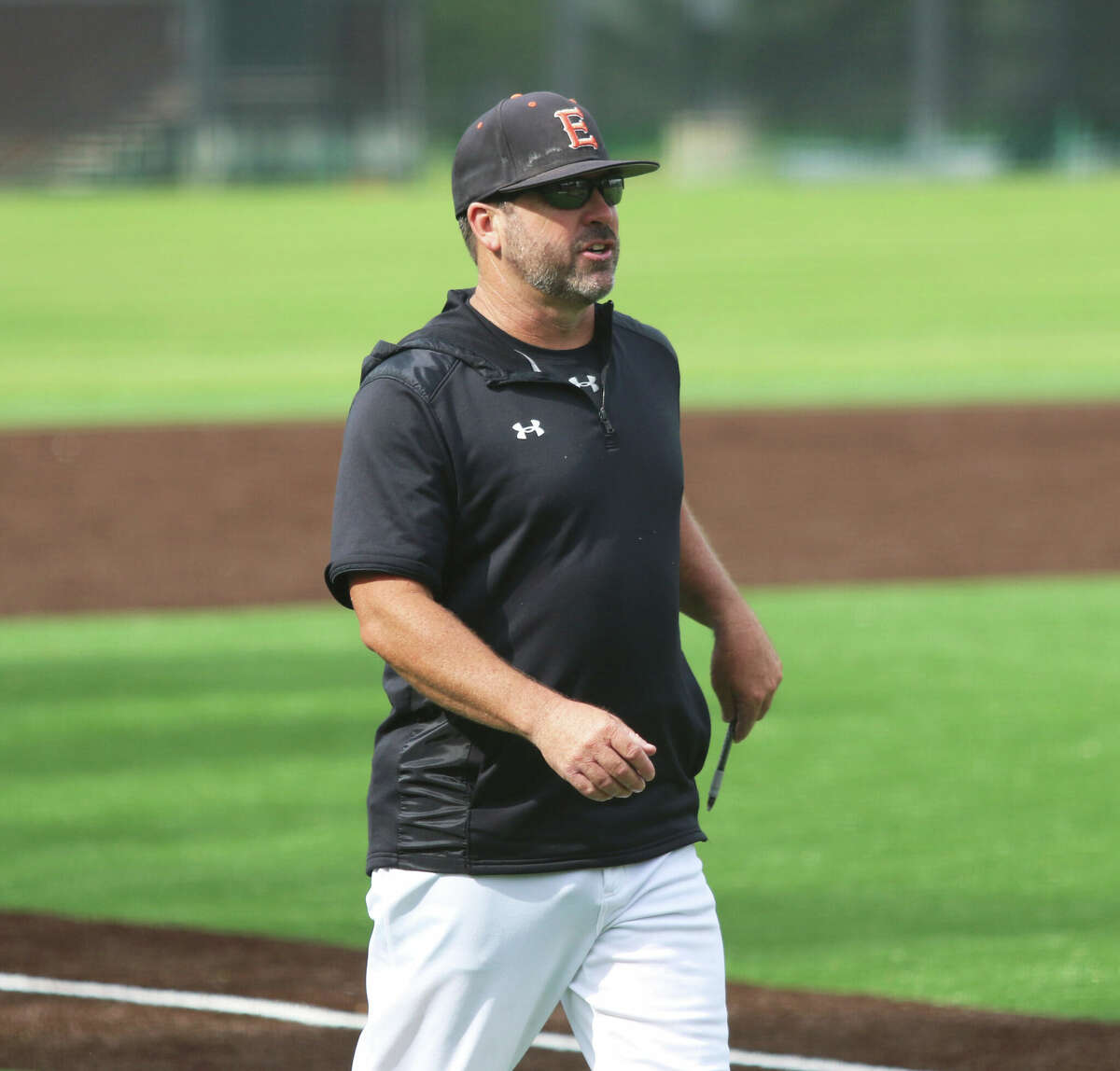 Edwardsville coach Tim Funkhouser looks approaches the plate umpire to during the Tigers' win in last season's Bloomington Class 4A Super-Sectional at Illinois Wesleyan.