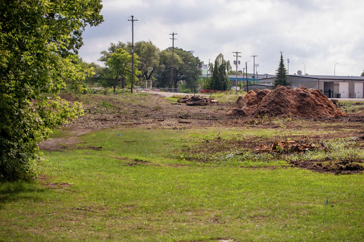 An area for Tittabawassee riverfront revitalization sits with trees cut down on August 4, 2022 near the Tridge.