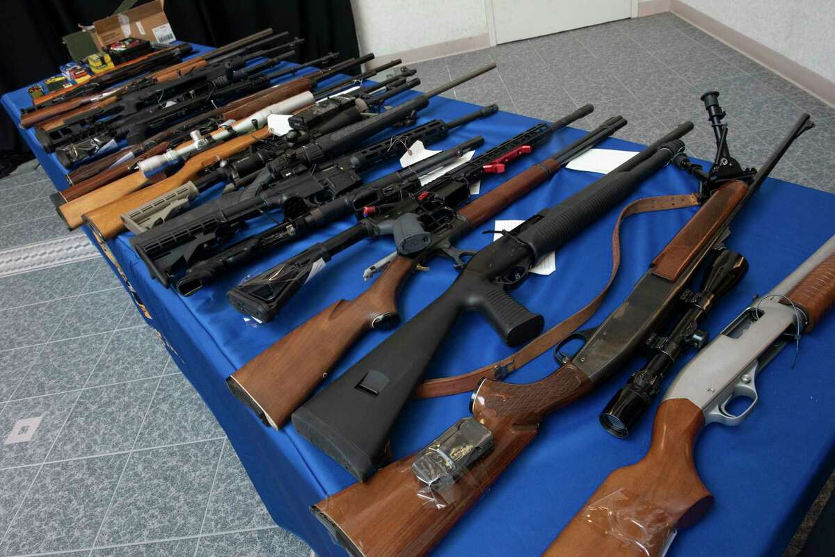 Seized guns are seen on a table during a news conference at the New York State Police Forensic Investigation Center in August 2022.