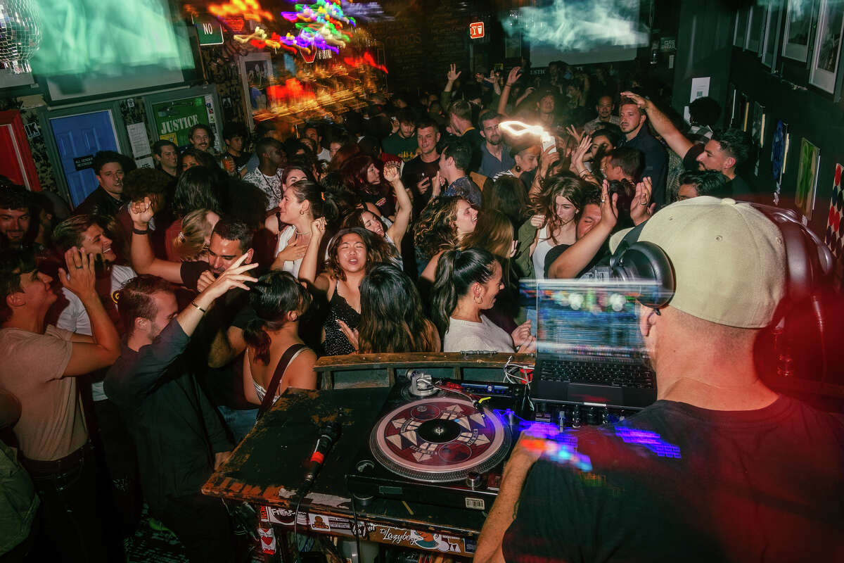 Resident DJ and founder of Motown on Mondays Donovan "Gordo Cabeza" Hall gets the crowd jumping at Madrone Art Bar on July 25, 2022, and every Monday night at the legerndary bar's historic event.