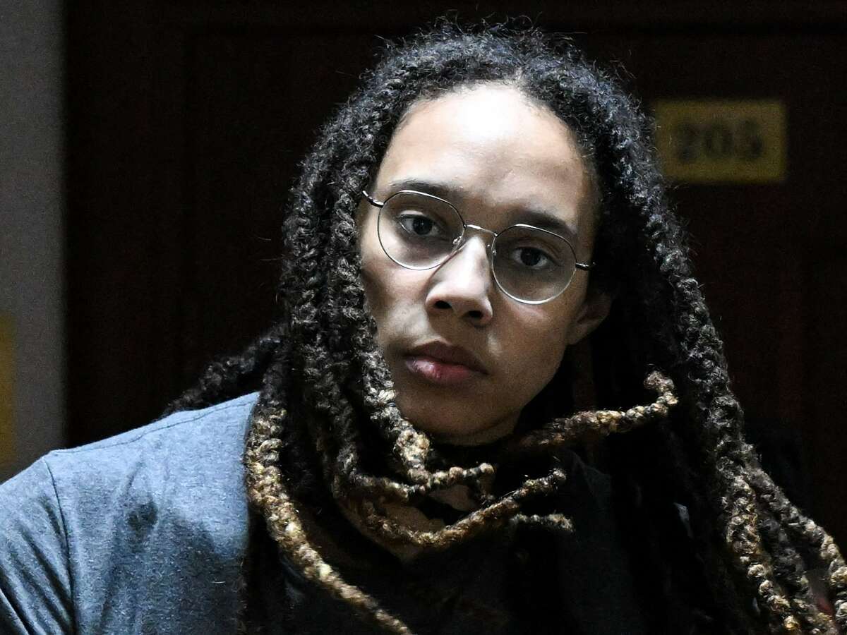 US Women National Basketball Association's (WNBA) basketball player Brittney Griner, who was detained at Moscow's Sheremetyevo airport and later charged with illegal possession of cannabis, is escorted to the courtroom to hear the court's final decision in Khimki outside Moscow, on August 4, 2022. 