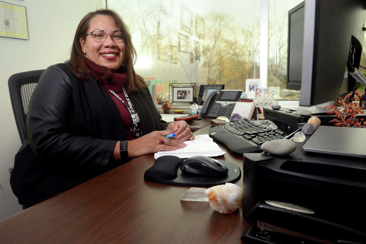 Digna Marte, the Diversity, Equity and Inclusion Director for Fairfield Public Schools, poses in her office in Fairfield, Conn. Feb. 2, 2022.
