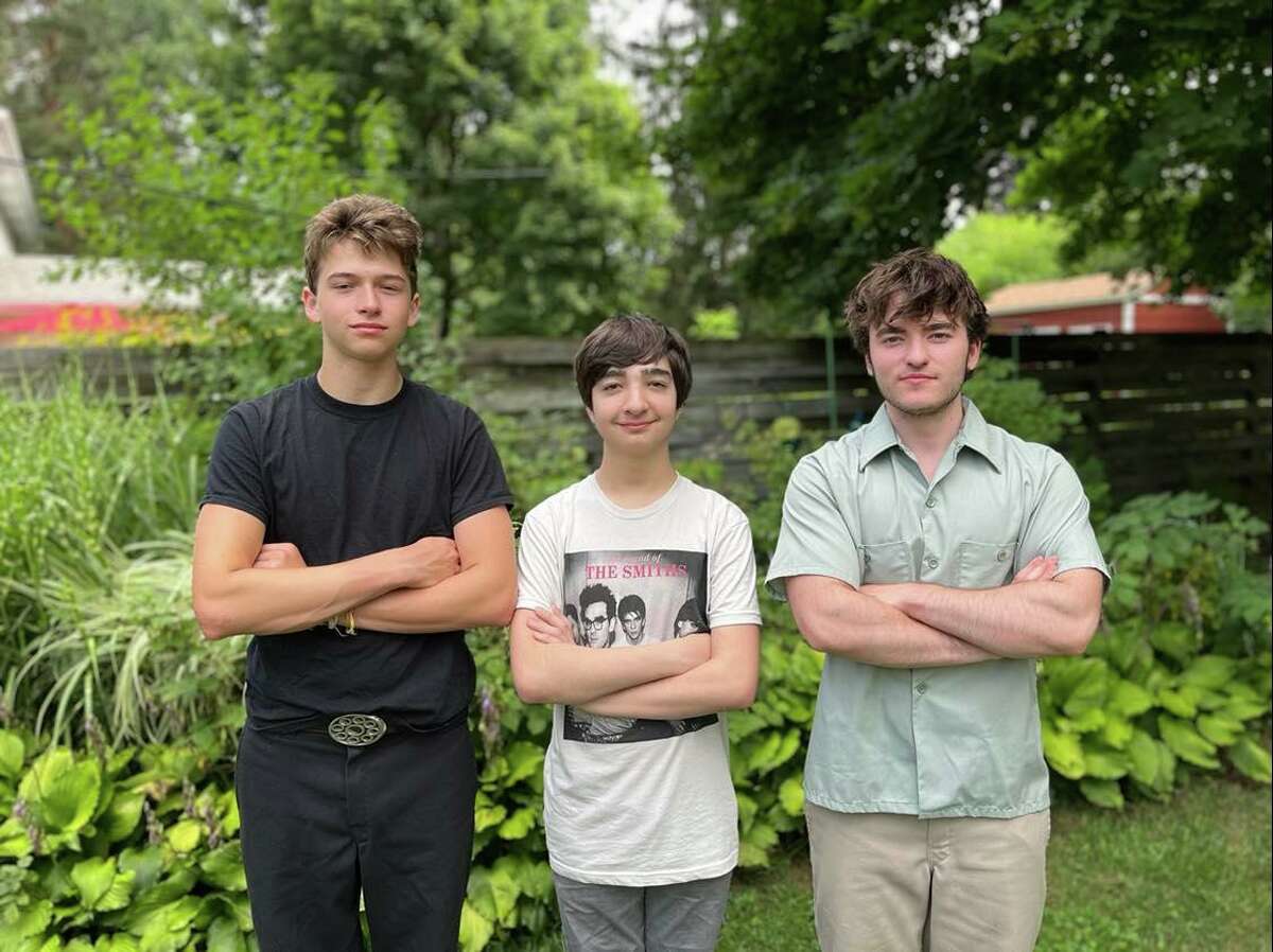 Mason DeFoe of Orlando, Florida; Reese Poole of Dallas, Texas; and Levi Ebnit of Midland pose at Ebnit's home on Aug. 4, 2022. The three friends will perform on Saturday as part of the River Days Festival.