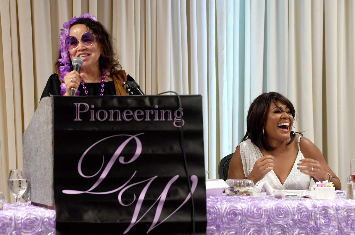 Jackie Simien laughs as founder Georgine Guillory offers closing remarks at this year's annual Pioneering Women luncheon. Photo made Thursday, August 4, 2022. Kim Brent/The Enterprise