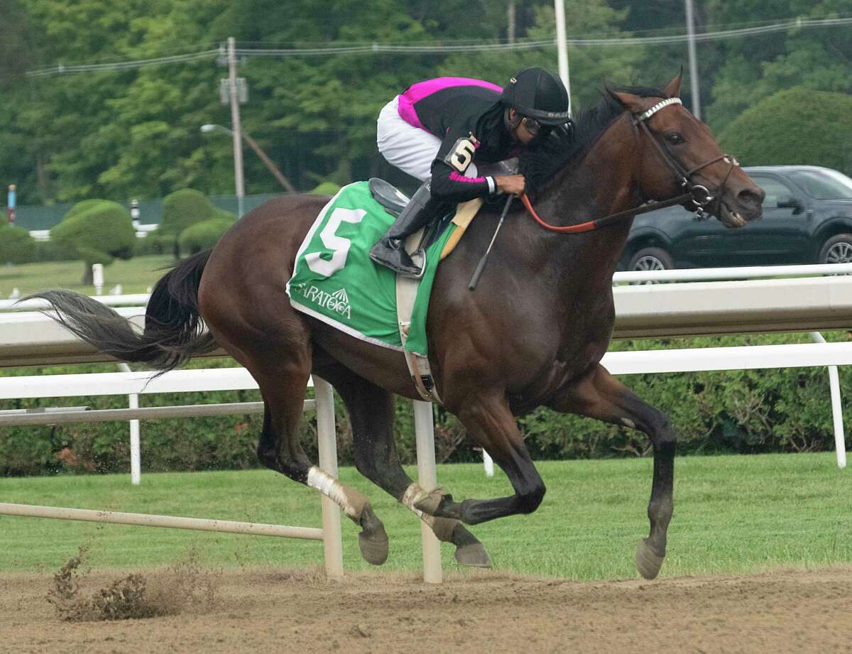 Jockey Luis Saez rides Art Collector down the stretch to win the Alydar Stakes in the eighth race at Saratoga Race Course on Thursday, Aug. 4, 2022.