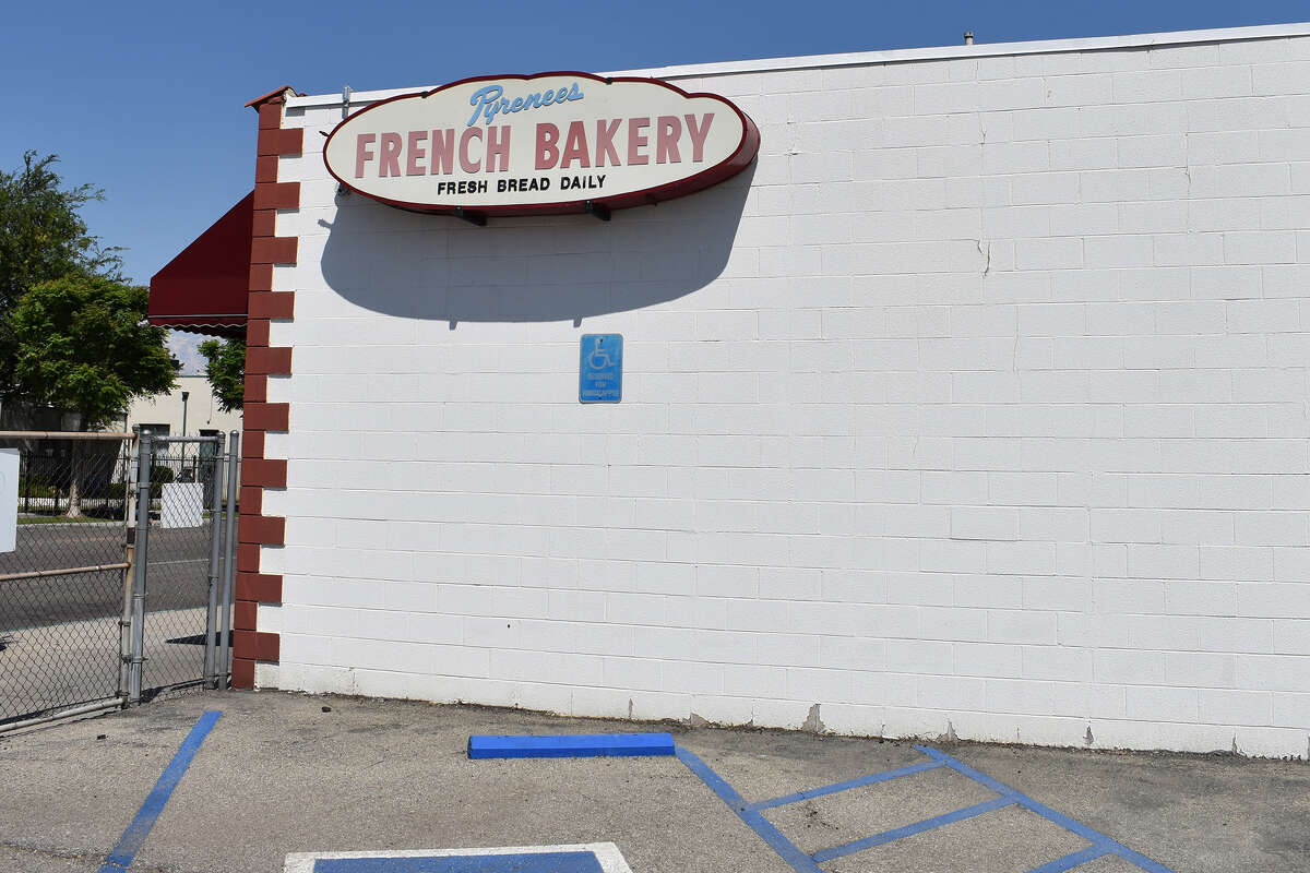 Original sign next to Pyrenees French Bakery at 717 E. 21st St. in Bakersfield. The bakery, which is celebrating his 135th anniversary this year, is struggling to keep up with its corporate competitors. 