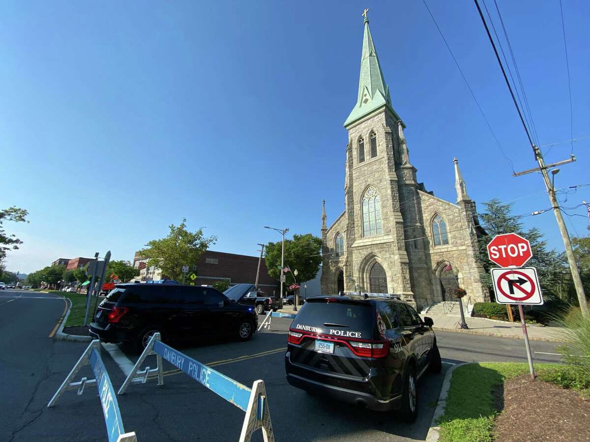 St. Peter Church in Danbury. Police surrounded the church while a wake for a woman and her three children took place Thursday afternoon.