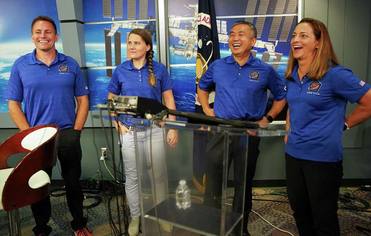 The NASA’s SpaceX Crew-5: NASA astronaut Josh Cassada, from left, Roscosmos cosmonaut Anna Kikina, JAXA astronaut Koichi Wakata, and NASA astronaut Nicole Mann share a laugh as they leave a press conference on Thursday, Aug. 4, 2022 in Houston.
