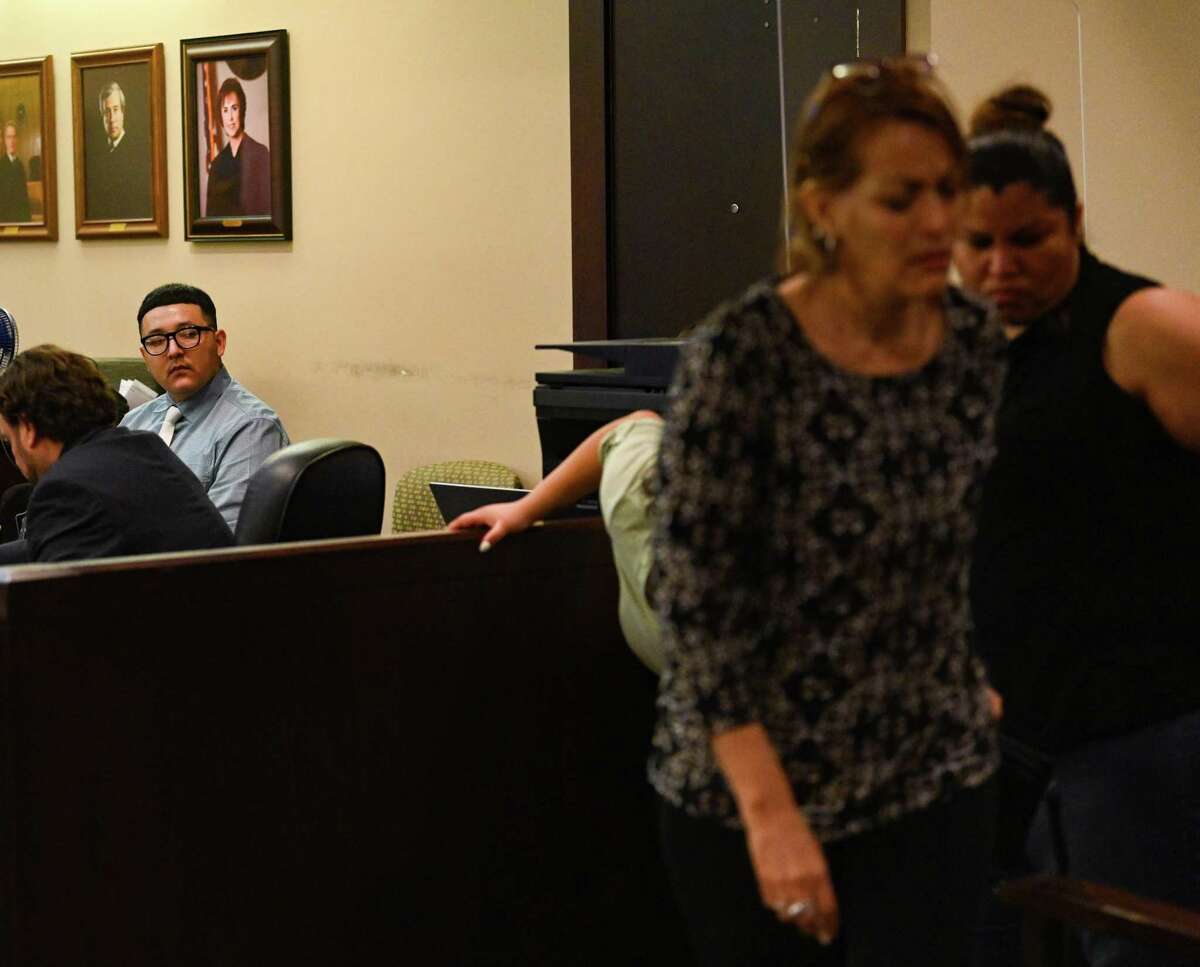Jorge Izquierdo, accused of fatally shooting his girlfriend, Cora Nickel, following an argument on Aug. 20, 2020, looks at his family after being found guilty of murder in 175th District Court in San Antonio on Thursday, Aug. 4, 2022.