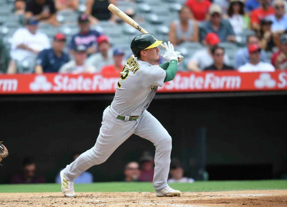 ANAHEIM, CA - AUGUST 04: Sean Murphy #12 of the Oakland Athletics hits a two RBI double against the Los Angeles Angels on in the third inning at Angel Stadium of Anaheim on August 4, 2022 in Anaheim, California. (Photo by John McCoy/Getty Images)