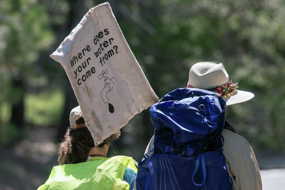 Nina Gordon-Kirsch, left, of Oakland, hikes along California Highway 4 in Alpine County, accompanied by Eva Orbuch on her way to the Mokelumne River headwaters. Nina finished her hike and kayak of the whole Mokelumne River from Oakland to its source at Lower Highland Lake, Friday, July 29, 2022.