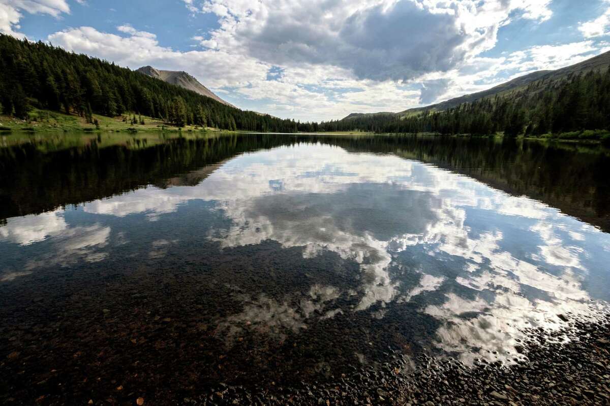 Lower Highland Lake, the source of the North Fork of the Mokelumne River, reflects the afternoon clouds. Nina Gordon-Kirsch, of Oakland, finished her hike and kayak of the whole Mokelumne River from Oakland to its headwaters in the Sierra, Friday, July 29, 2022.