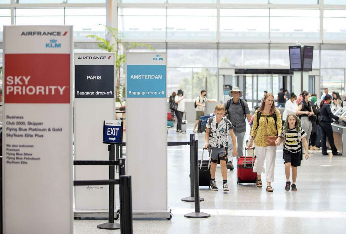 Travelers make their way at San Francisco International Airport’s International Terminal.