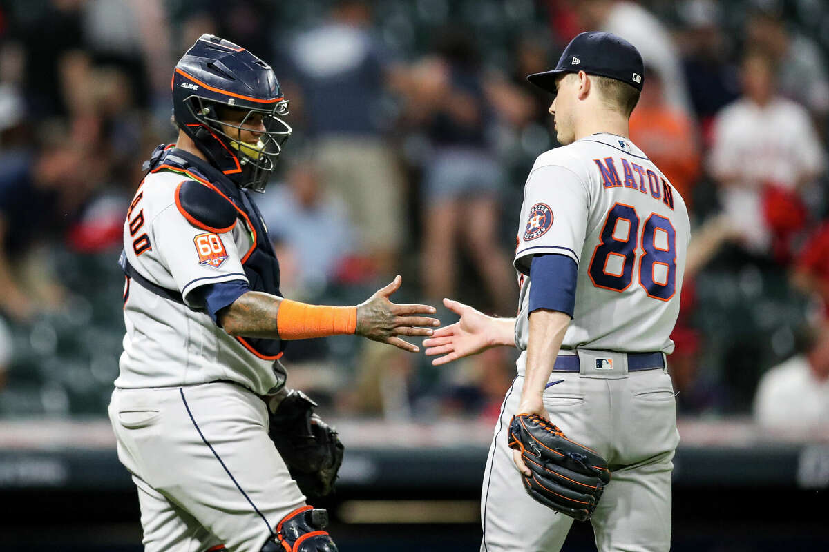 CLEVELAND, OH - AUGUST 04: Marti­n Maldonado #15 and Phil Maton #88 of the Houston Astros celebrate after beating the Cleveland Guardians 6-0 at Progressive Field on August 4, 2022 in Cleveland, Ohio. (Photo by Lauren Bacho/Getty Images)