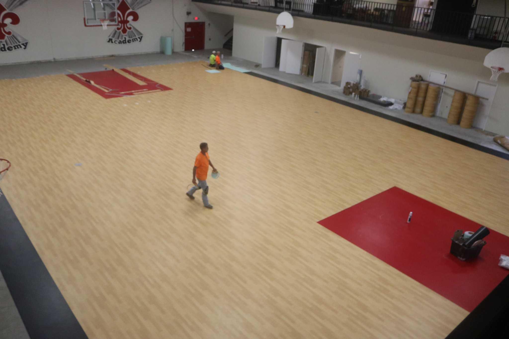 Gym floor symbol of school s strides to recover from water leak