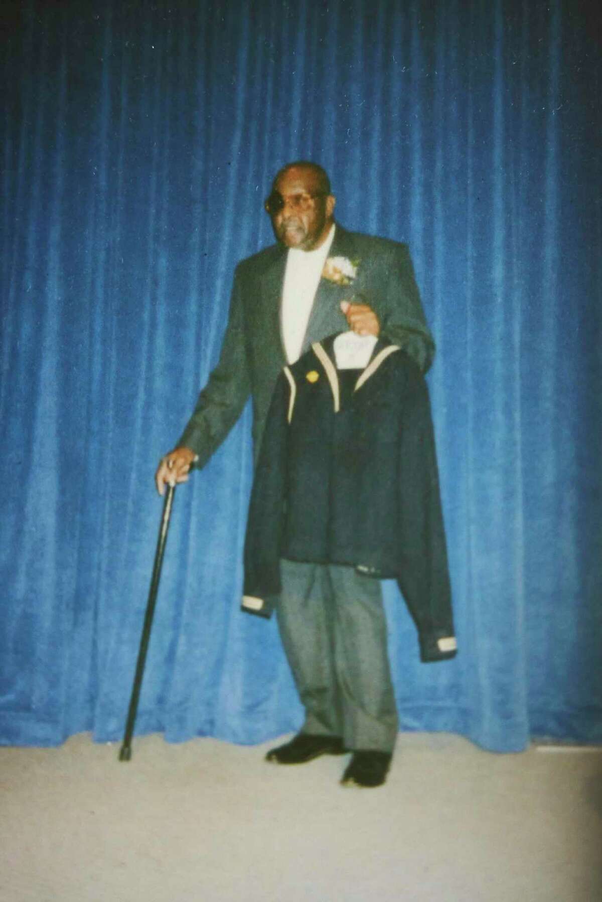 Freddie Meeks shows his Navy uniform from World War II.