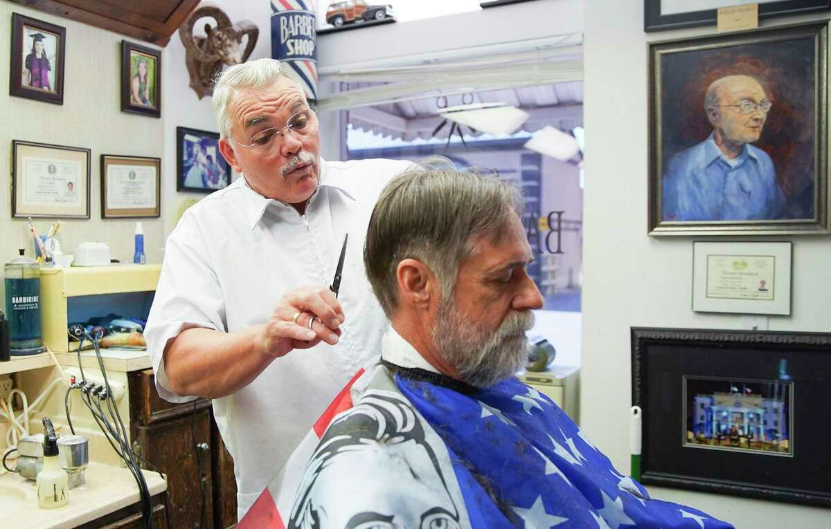 Leon Apostolo cuts the hair of Keith Moore at Shepard Barber Shop in downtown Conroe on Tuesday, Sept. 15, 2020. Shepard’s is considered the oldest barbershop in Texas and Leon will be happy to get your students ready for back to school.