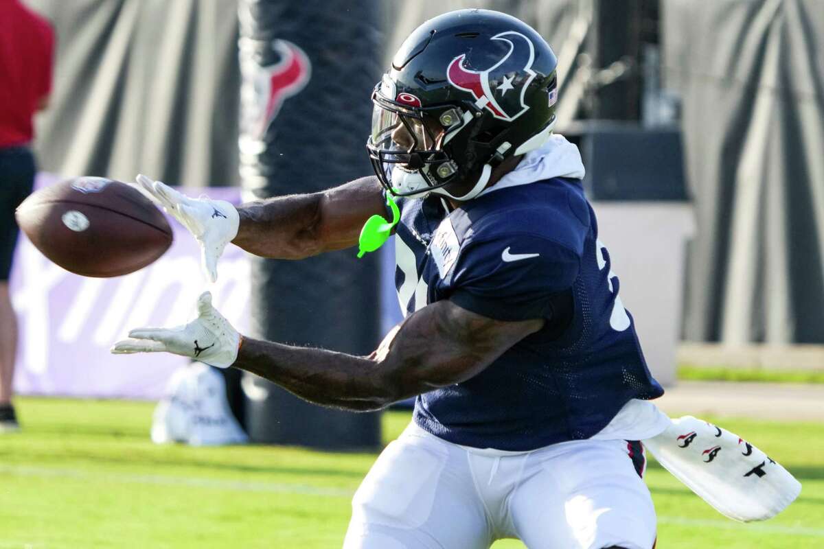 Houston Texans running back Dameon Pierce turns to make a catch during an NFL training camp Friday, Aug. 5, 2022, in Houston.