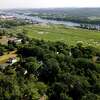 Beacon Island, right, above Anders Lane, lower left, showing homes near the cleared lot where a wind turbine construction site is planned on Thursday, Aug. 4, 2022, in Glenmont, N.Y.