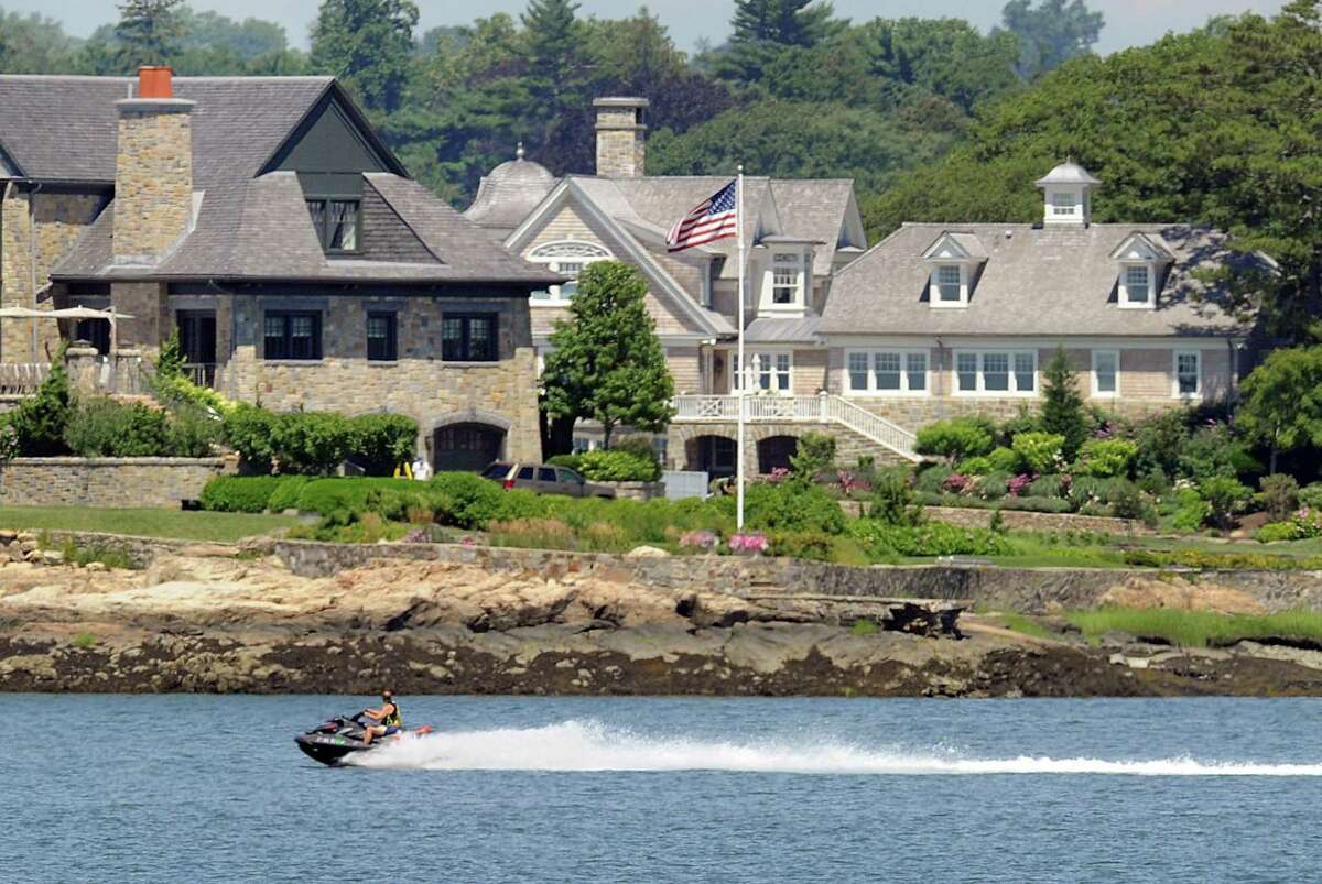 A jet-skier cruises out of Greenwich Cove into Long Island Sound.