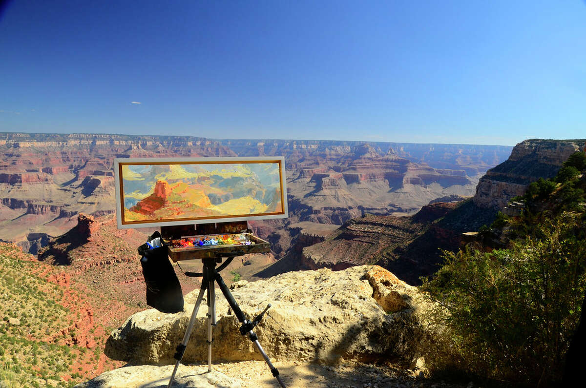 A painting next to the Grand Canyon from a past Grand Canyon Celebration of Art.