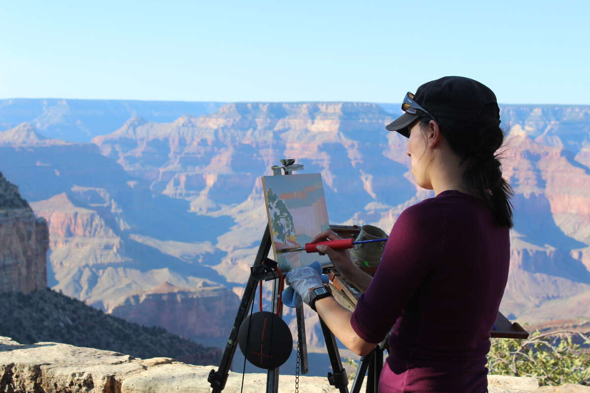 An artist painting the Grand Canyon as part of the Grand Canyon Celebration of Art.