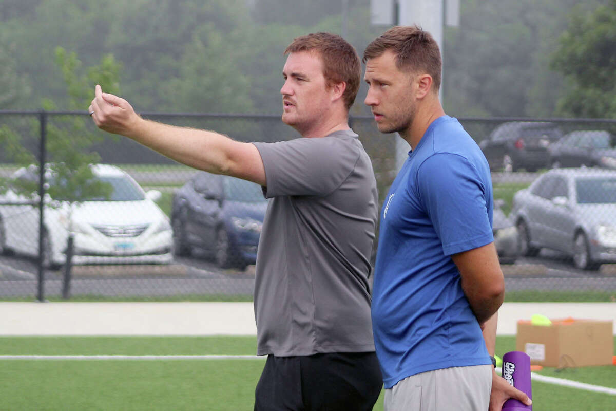 New Lewis and Clark Community College men's soccer coach John Dunn, left, and assistant coach Tim Findall look on during a preseason practice Friday at Glazebrook Park in Godfrey.