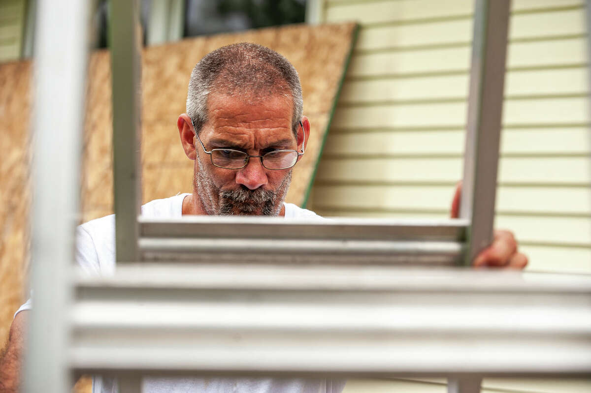 Greg Yancer, co-owner of Skills for Tomorrow Remodeling, works on a roof replacement project on Aug. 4, 2022 in the Midland area.