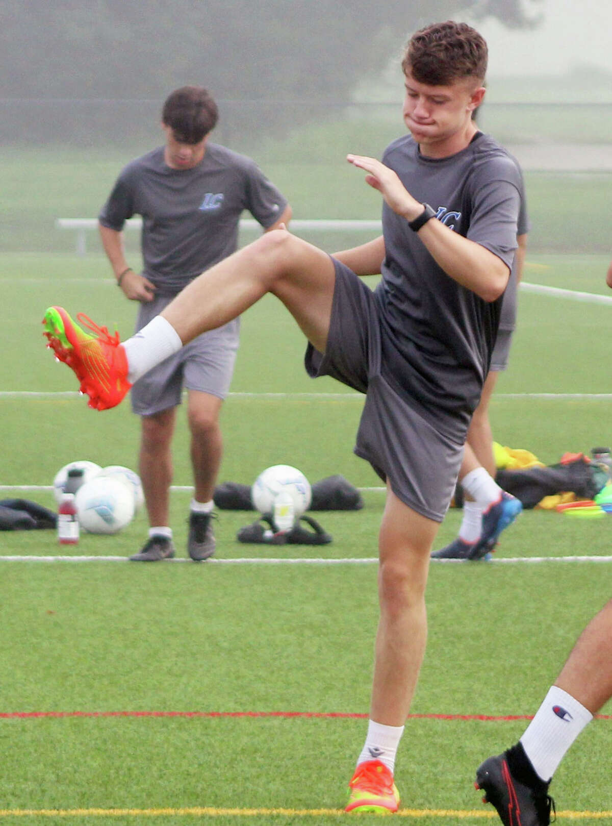 LCCC soccer player Josh Macklin goes through a pre-practice stretching exercise Friday at Glazebrook Park in Godfrey.