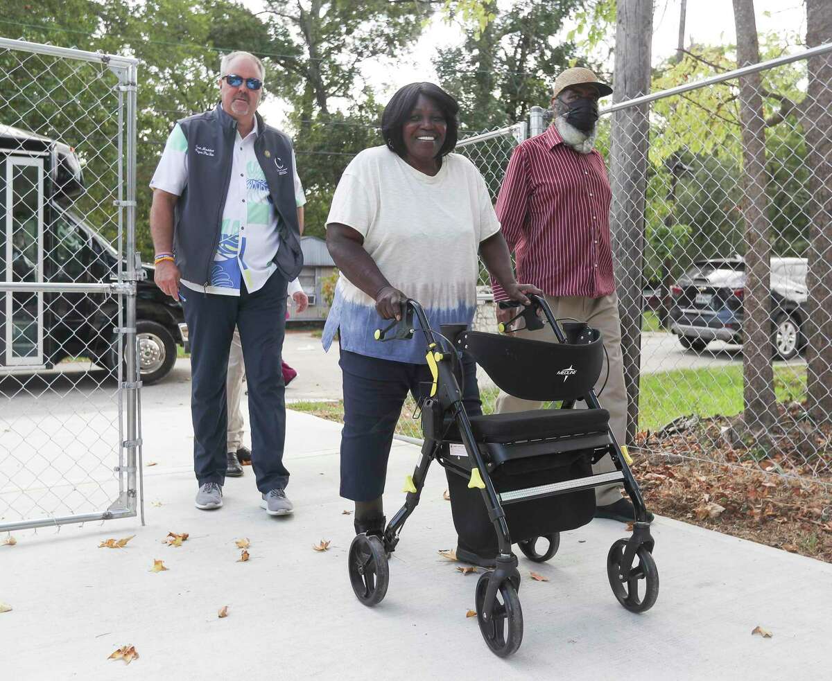 Odessa Sneed walks toward her rebuild home during a Community Development Block Grant home tour in Conroe, Thursday, Aug. 4, 2022, in Conroe. The CDBG is a federally funded program that provides home for low-income residents.