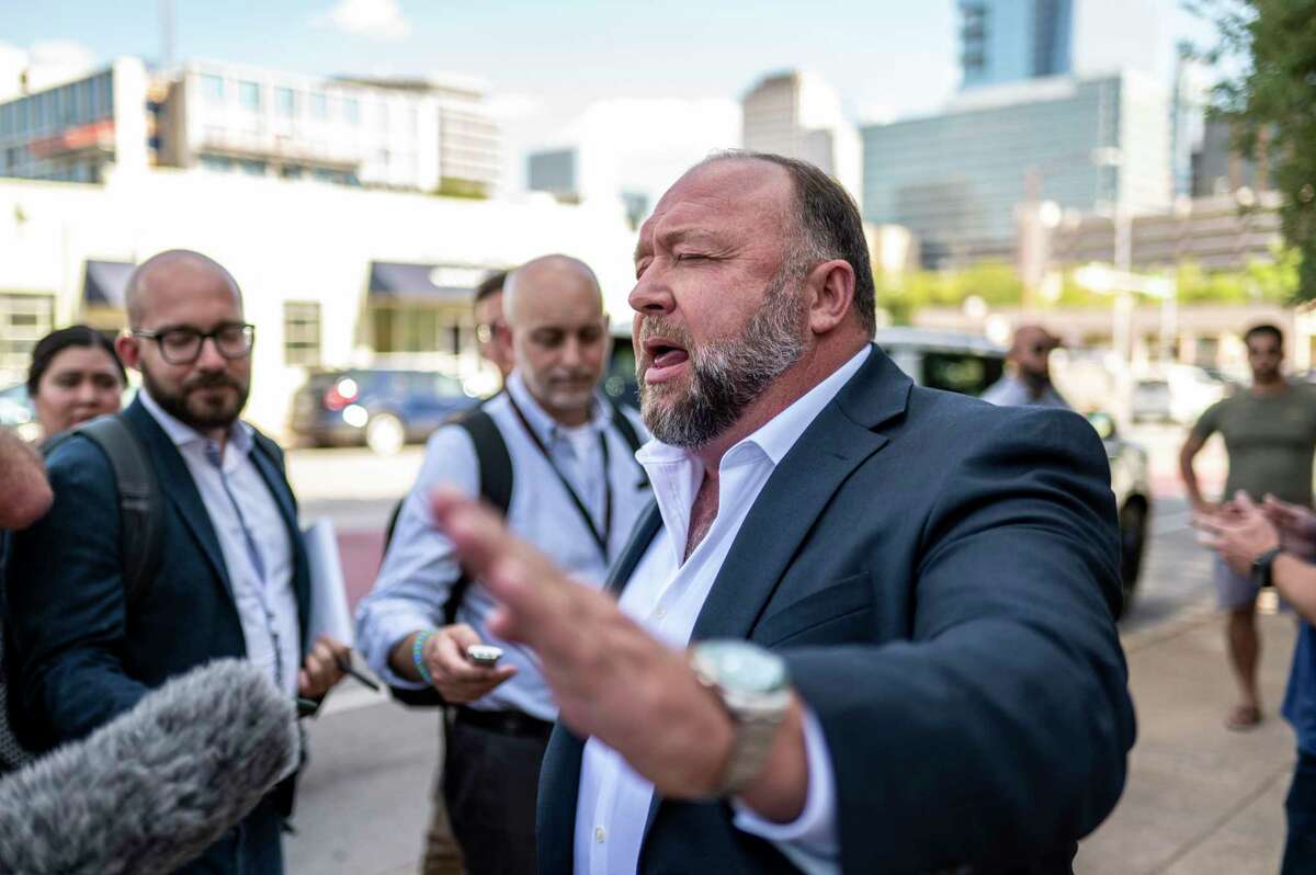 Alex Jones speaks to the media outside the 459th Civil District Court on Tuesday, Aug. 2, 2022 in Austin, TX. Neil Heslin and Scarlett Lewis are suing Alex Jones and InfoWars over his repeated claims that the 2012 shooting at Sandy Hook Elementary was a "false flag operation" conducted by the government. (Sergio Flores/Hearst Media)